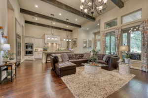 Spacious living room with modern kitchen and decor.