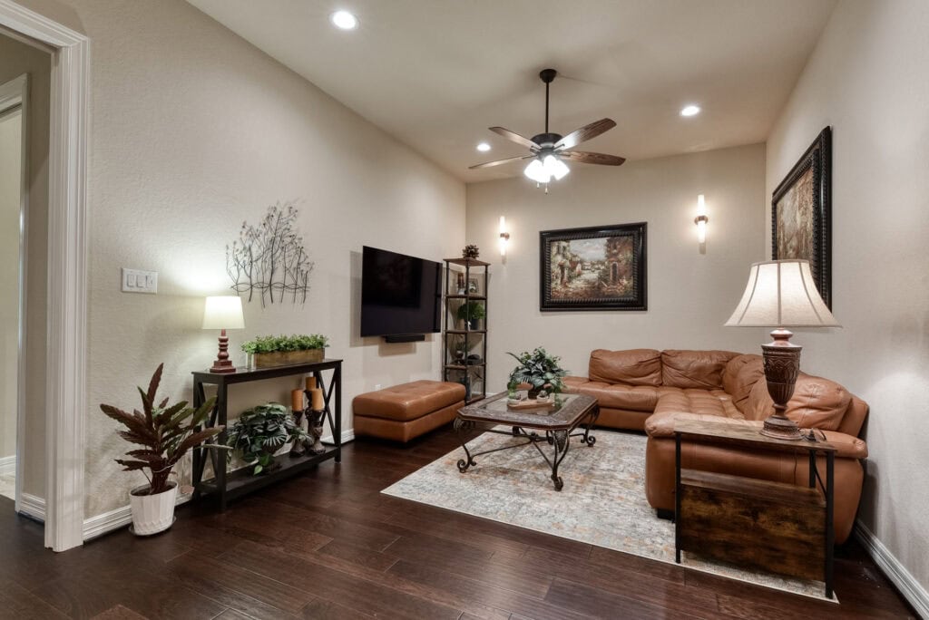 Cozy living room with leather sofa and decor.