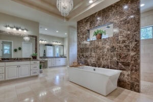 Luxurious bathroom with tub and chandelier