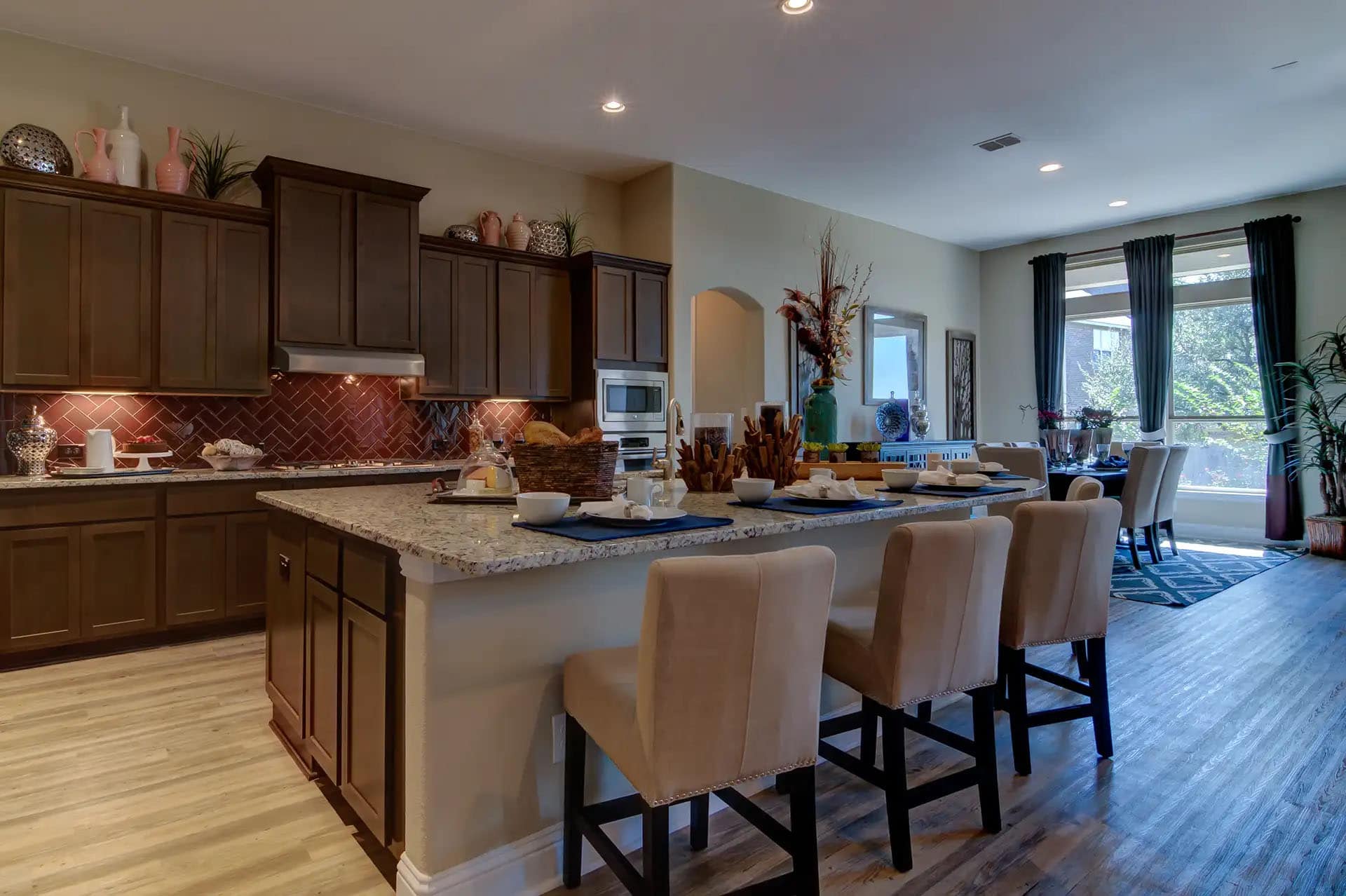 Modern kitchen and dining area with island seating.
