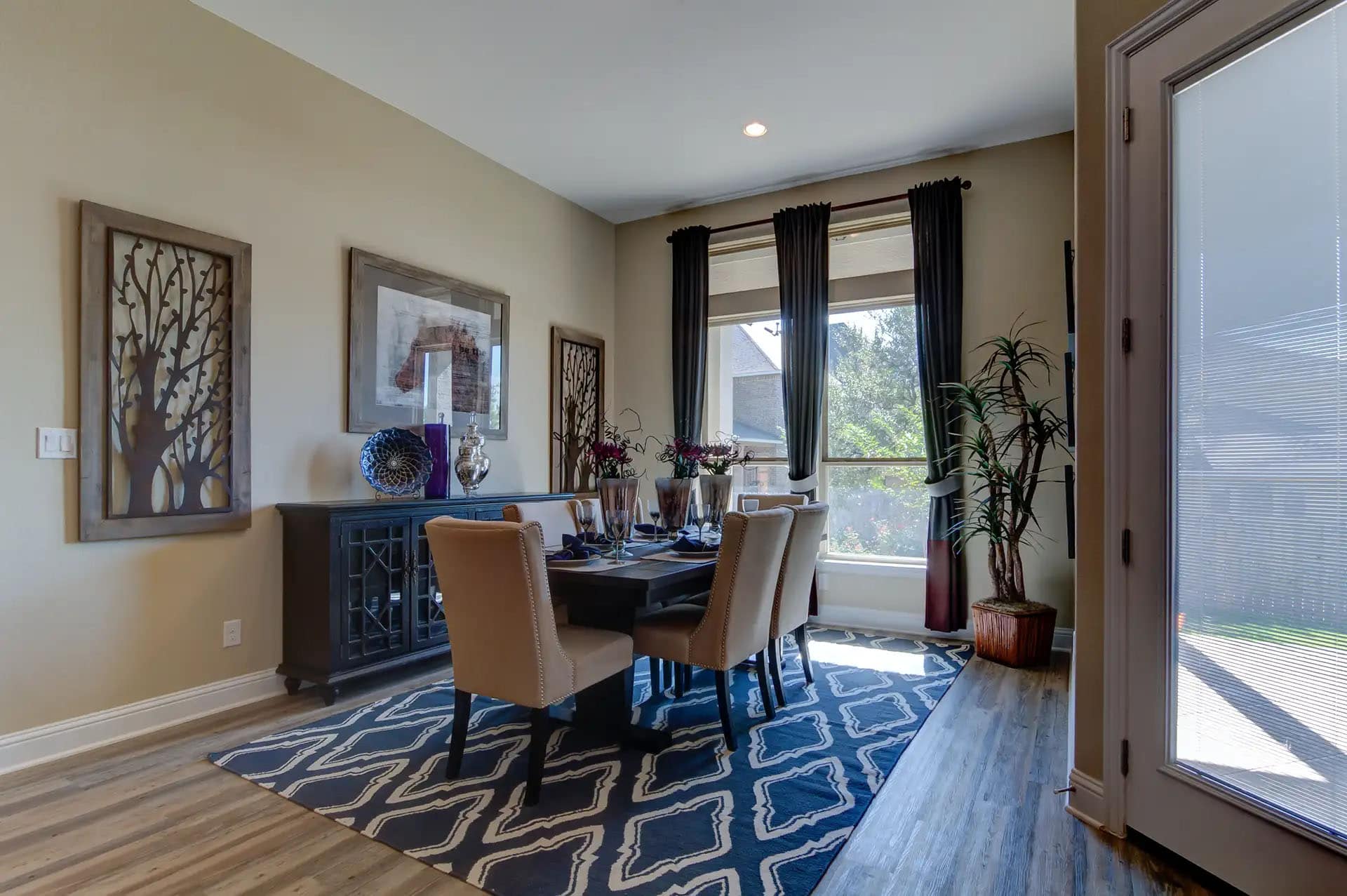 Elegant dining room with modern decor and artwork.