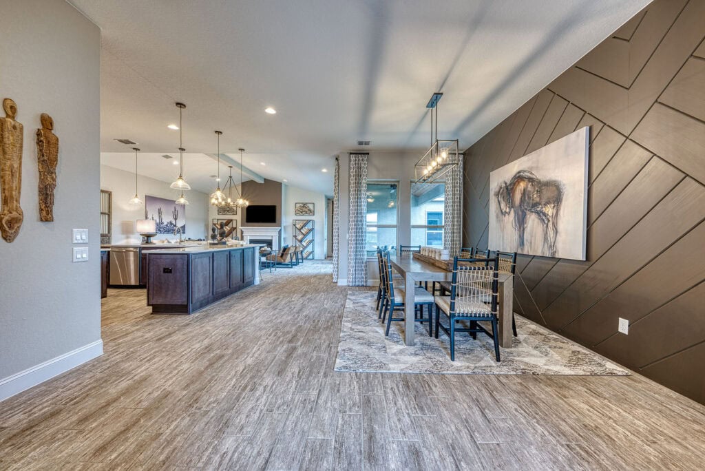 Modern open-concept kitchen and dining area with artwork.