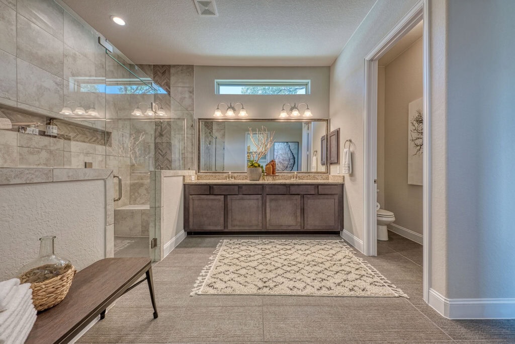 Modern bathroom with double vanity and glass shower