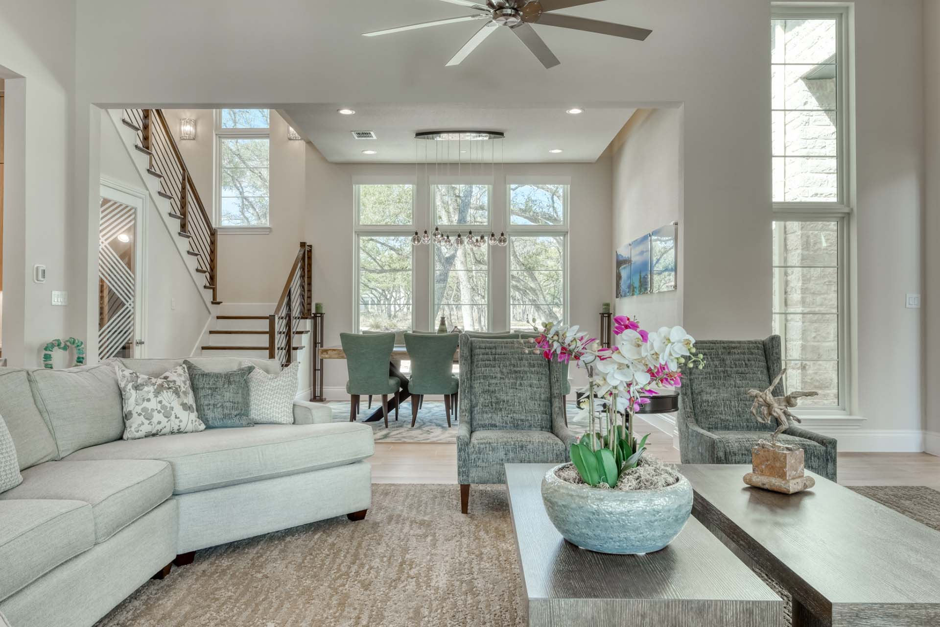 Modern living room with large windows and decor