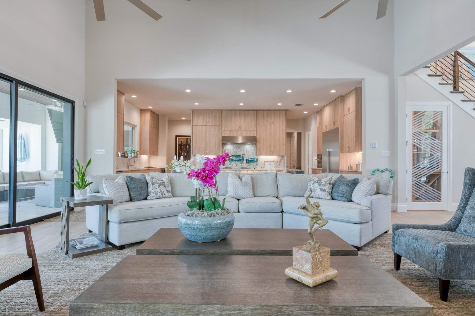 Modern living room with large sofa, elegant decor.