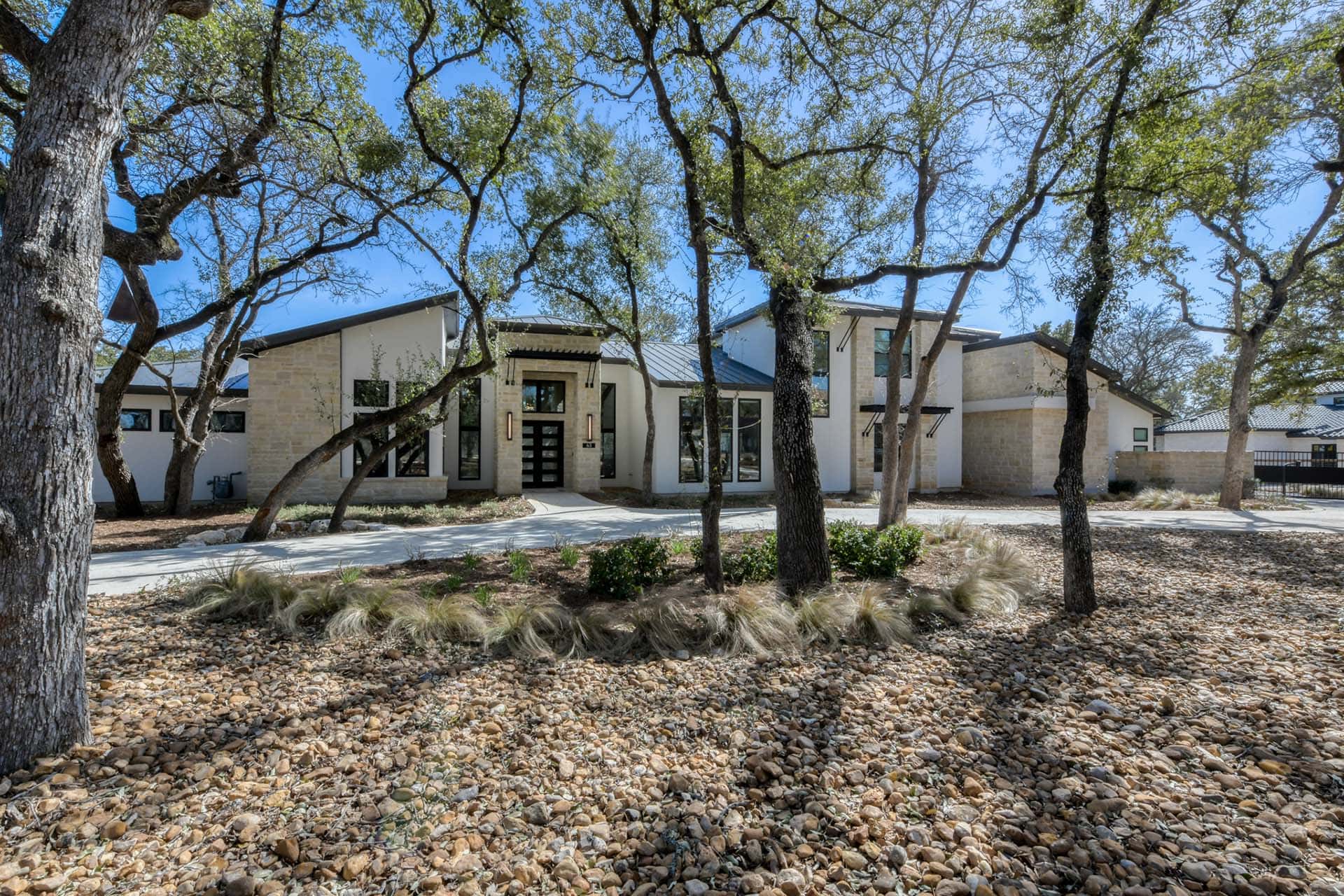Modern house with stone exterior and trees