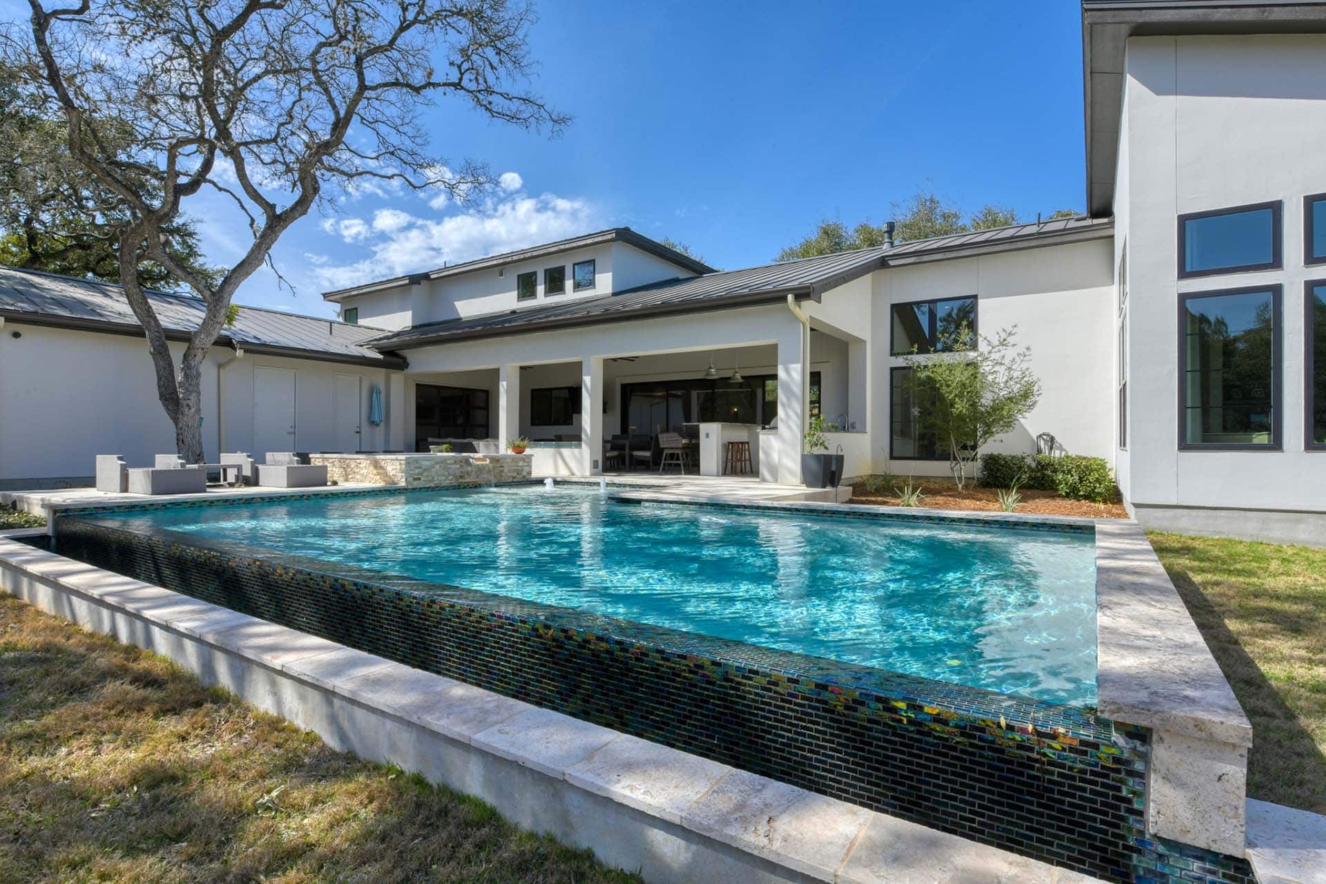 Modern house with a backyard swimming pool.