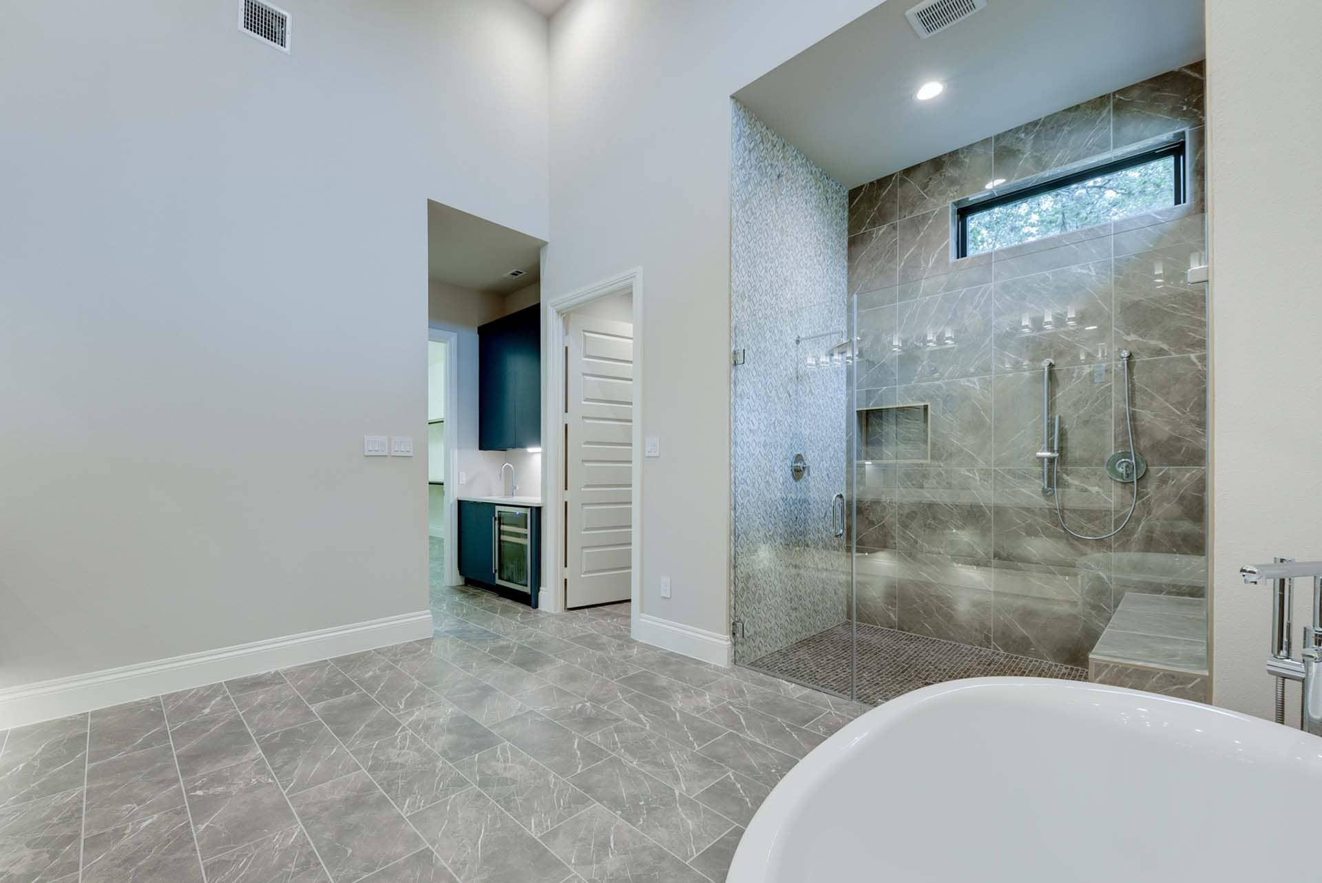 Modern bathroom with glass shower and tub