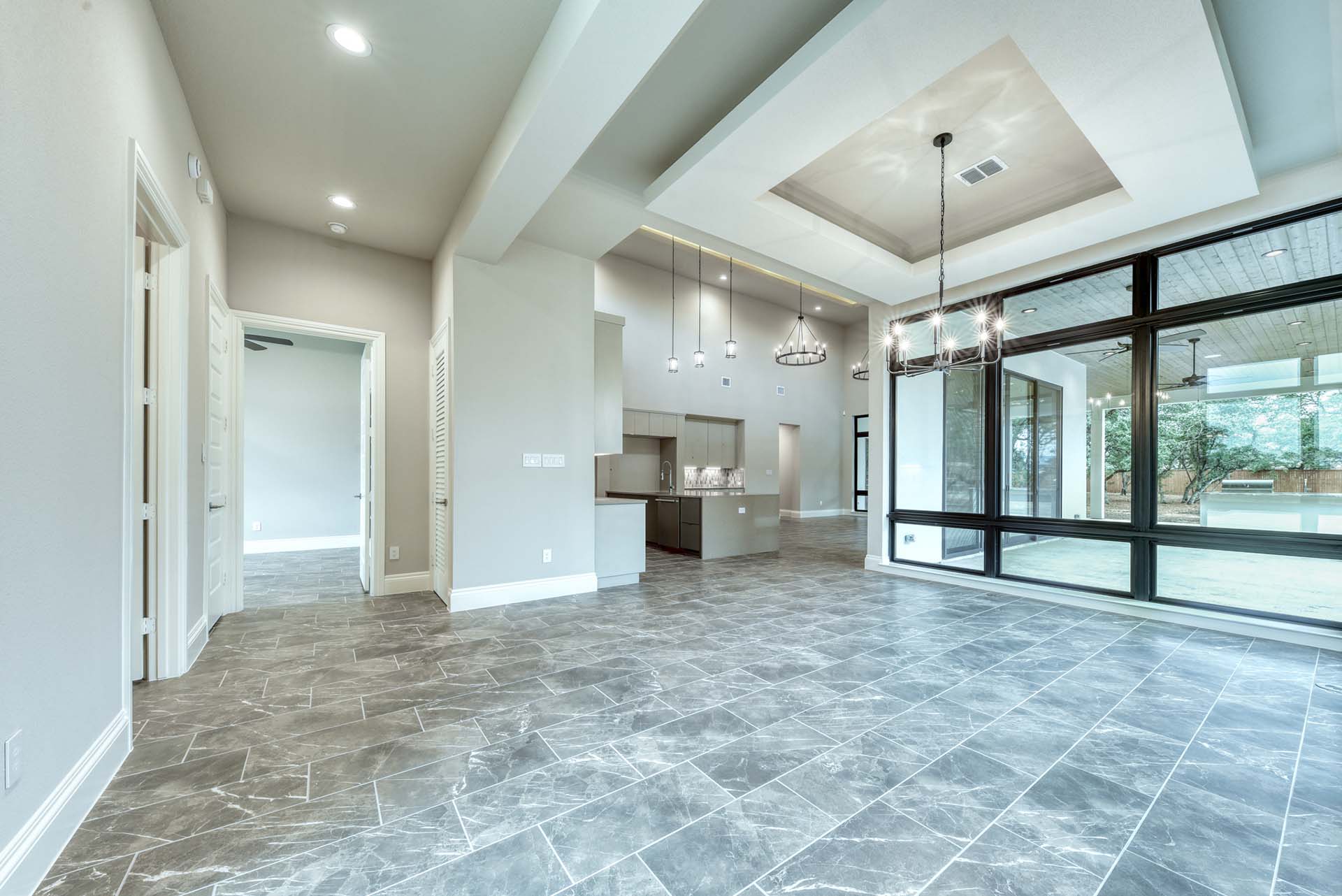 Spacious modern living area with large windows.