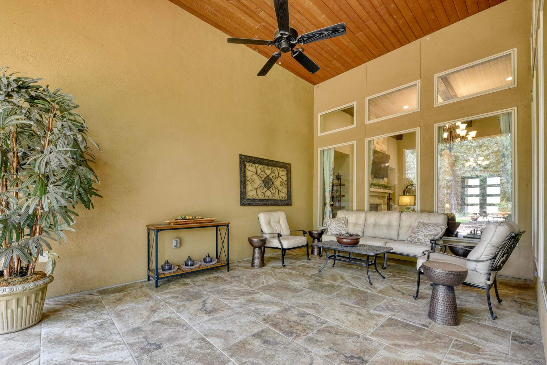 Spacious patio with seating and ceiling fan
