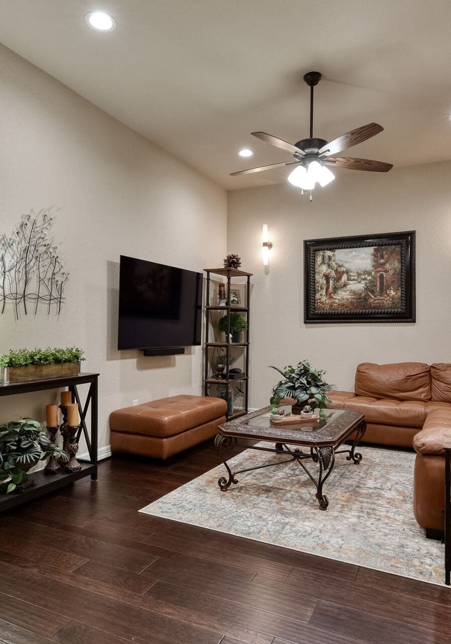 Cozy living room with leather sofa and decor.