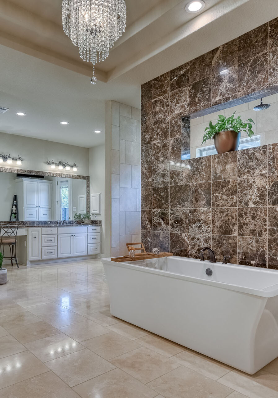 Luxurious bathroom with tub and chandelier