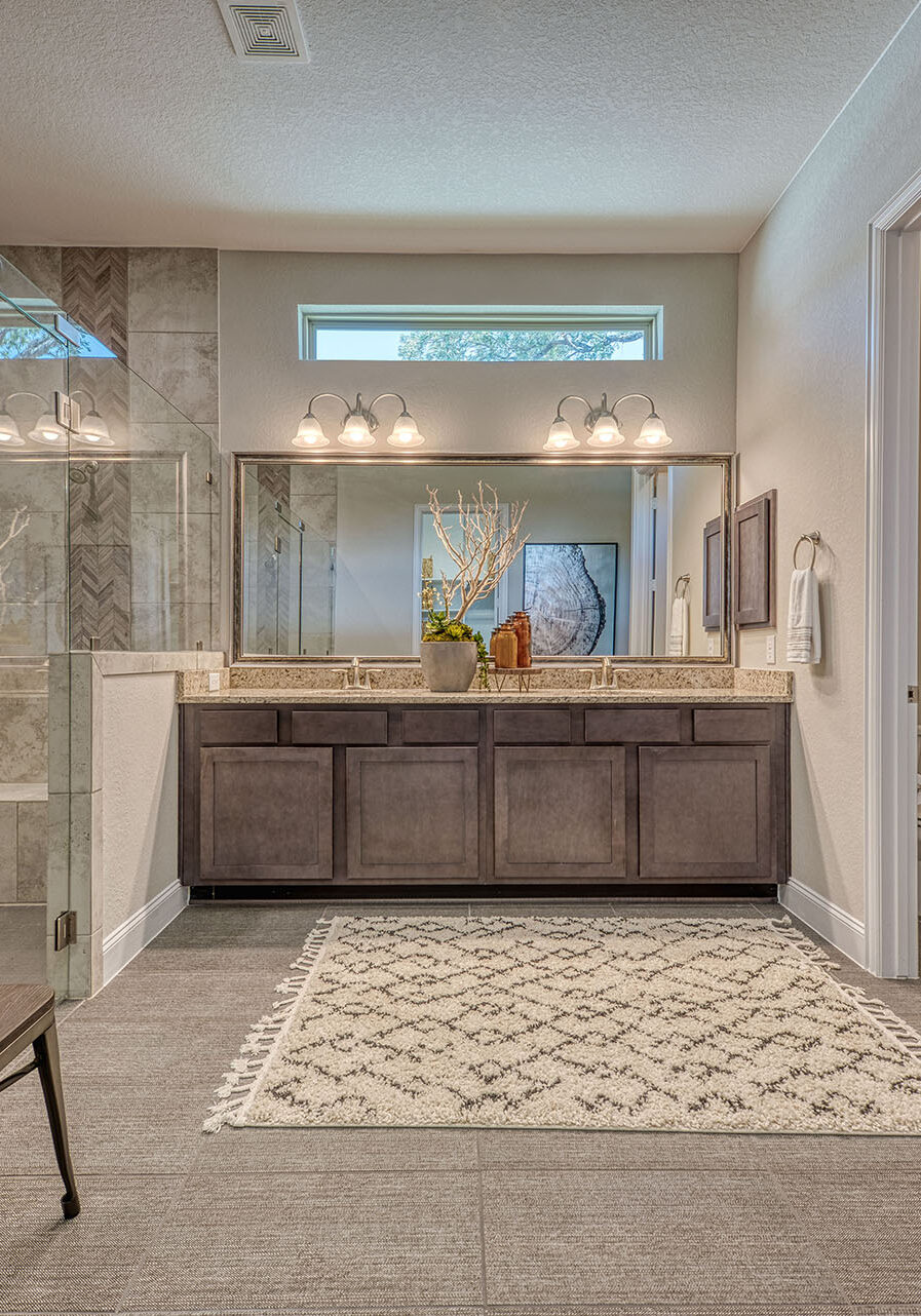 Modern bathroom with double vanity and glass shower
